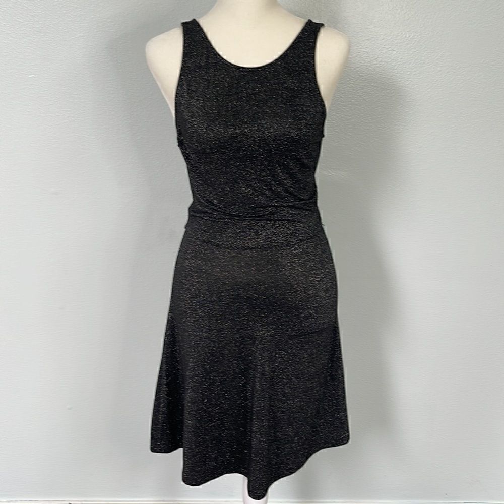 Divided little black dress.  Size 4. Lots of sparkle!